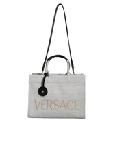 Bolsa transversal Versace branca com alça superior em couro e lona com logotipo