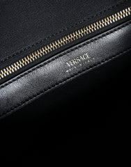 Bolsa transversal Versace preta com alça superior em couro e lona com logotipo